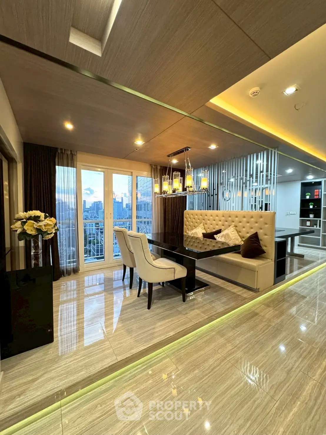 Luxurious modern living room with elegant dining area and city view balcony.