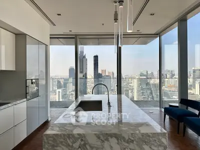Luxurious kitchen with marble island and stunning city skyline view