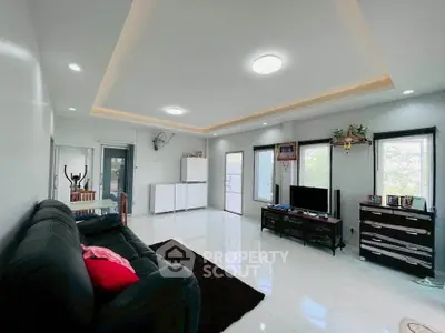 Spacious modern living room with sleek design and ample natural light