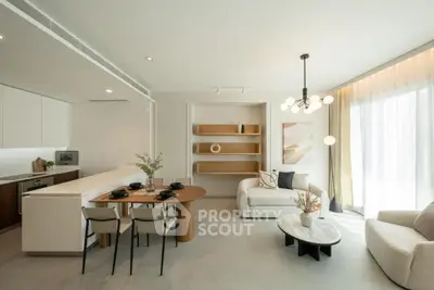 Modern open-plan living room with stylish furniture and natural light