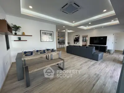 Spacious modern living room with elegant dining area and stylish decor