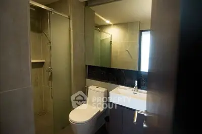 Modern bathroom with sleek design and glass shower enclosure