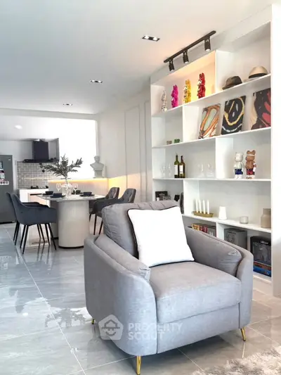 Stylish open-plan living room with modern decor and dining area