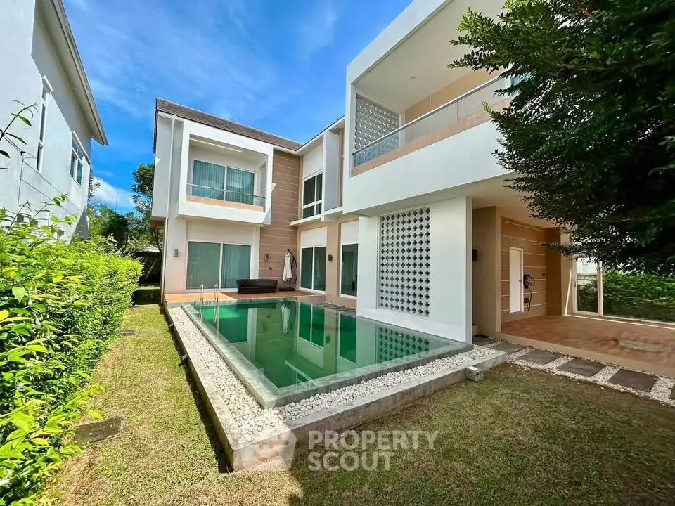 Luxurious modern villa with private pool and lush garden, perfect for serene living.