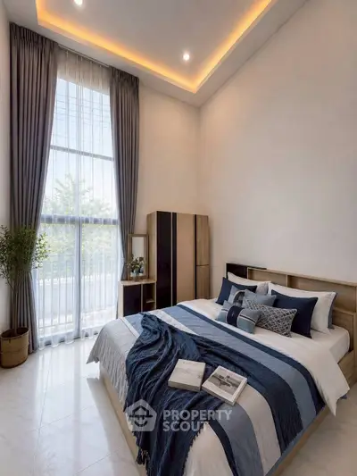 Elegant bedroom with high ceiling and large window, featuring modern decor and cozy bedding.