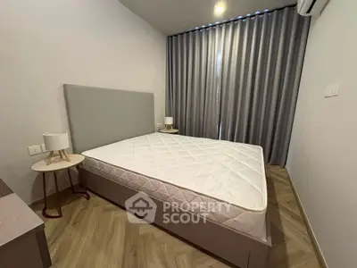 Modern bedroom with stylish decor and large window curtains