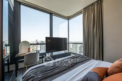 Luxurious bedroom with panoramic city view and modern decor