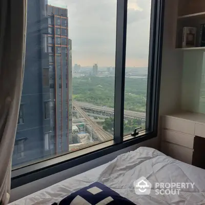 Stunning cityscape view from modern bedroom window in high-rise apartment