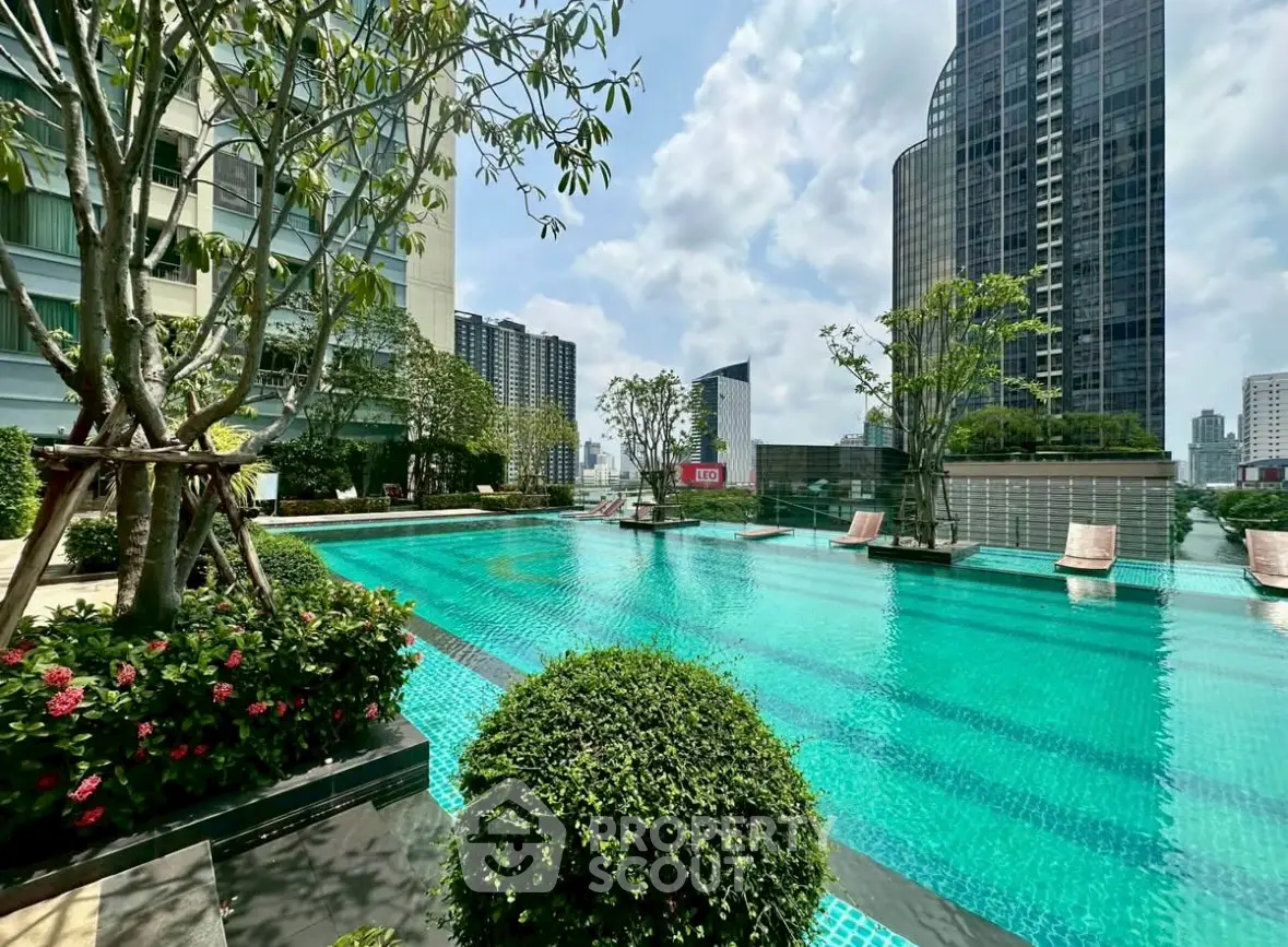 Luxurious rooftop pool with stunning cityscape views in modern high-rise building.
