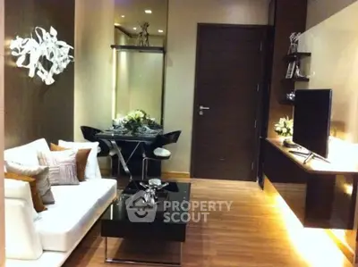 Modern living room with sleek furniture and stylish decor, perfect for urban living.