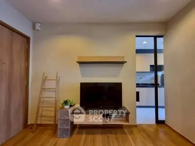 Modern living room with wooden flooring and open kitchen view