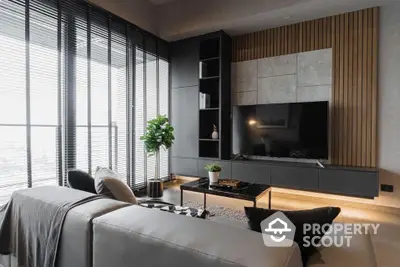 Luxurious living room with modern design, sleek furniture, and large windows offering ample natural light and a serene view, perfect for upscale urban living.