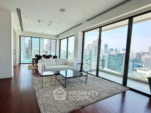 Luxurious high-rise living room with stunning cityscape views and modern decor.