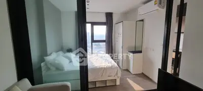 Modern bedroom with large window and city view, featuring sleek furniture and air conditioning.