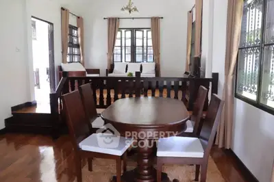 Charming living room with elegant wooden furniture and natural light