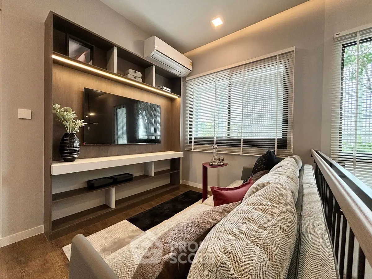 Modern living room with stylish decor and large windows for natural light