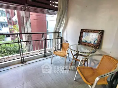 Charming balcony with stylish seating and scenic view, perfect for relaxation and outdoor enjoyment.