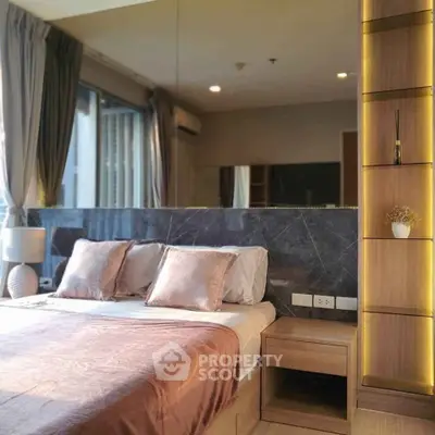 Luxurious bedroom with elegant decor and natural light, featuring a stylish bed and modern furnishings.