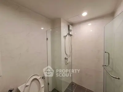 Modern bathroom with glass shower and sleek tile design