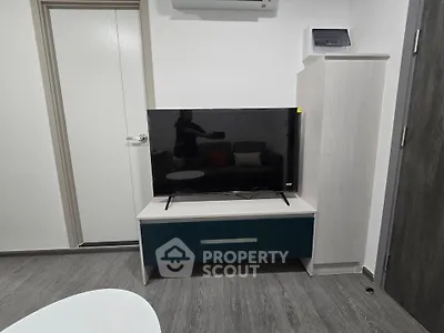 Modern living room with sleek TV setup and stylish furniture
