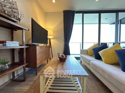 Stylish living room with modern decor and large windows offering natural light.
