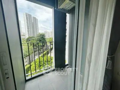 Charming balcony with city view in modern apartment, perfect for relaxation and enjoying the skyline.
