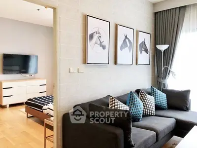 Stylish living room with modern decor and cozy seating in a bright apartment.