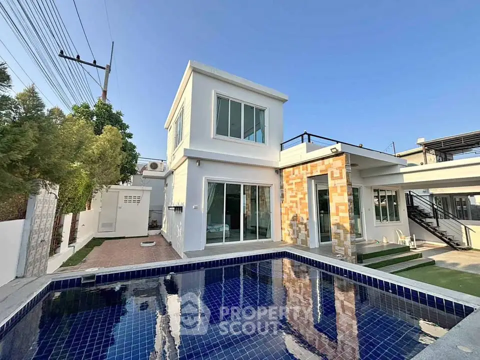 Modern two-story house with private pool and stylish exterior design