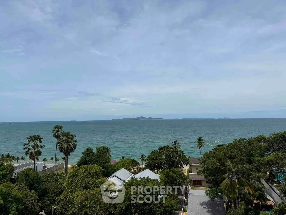 Stunning ocean view from a high vantage point, showcasing lush greenery and distant islands.