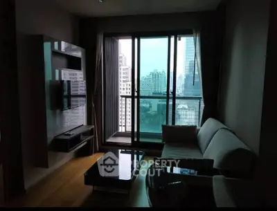Modern living room with city view, featuring sleek furniture and large windows.