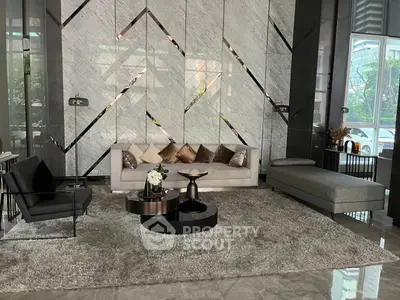Luxurious modern living room with elegant furniture and marble accents