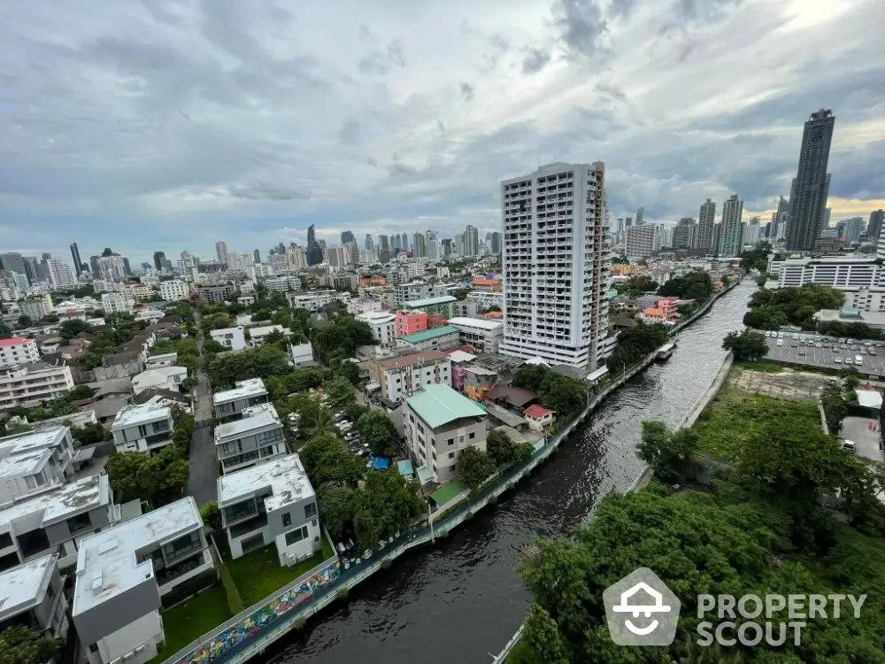 Stunning cityscape view with river and modern high-rise buildings