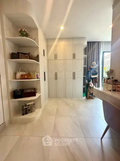 Spacious modern bedroom with built-in storage and elegant decor