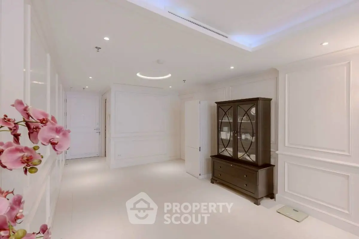 Elegant white interior with classic molding and stylish furniture