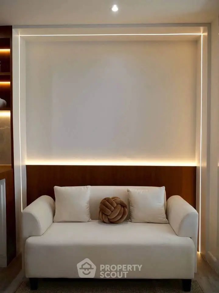 Modern living room with stylish sofa and ambient lighting