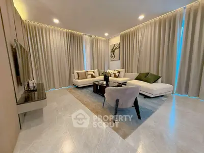 Luxurious modern living room with elegant decor and cozy seating area.