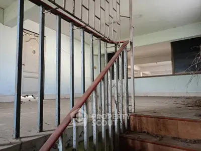 Explore potential in this spacious fixer-upper with unique architectural features and open layout.