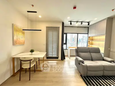 Modern living room with city view, cozy seating, and stylish dining area.