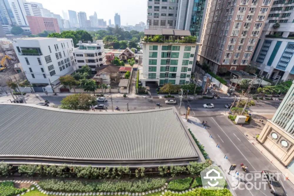 Stunning cityscape view from high-rise building showcasing urban living and modern architecture.