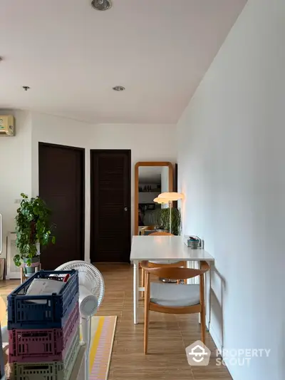 Modern study room with sleek desk and chair, bright lighting, and minimalist decor