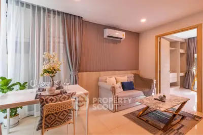 Modern living room with elegant decor, cozy sofa, dining area, and air conditioning in a stylish apartment.