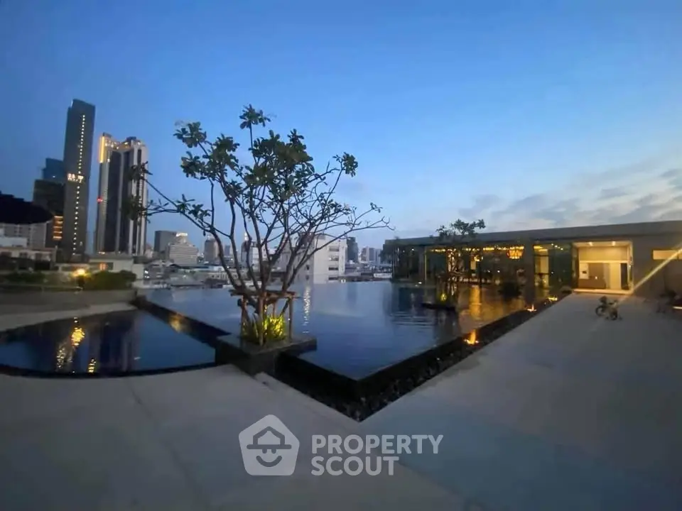 Stunning rooftop pool with city skyline view at dusk, perfect for luxury living.