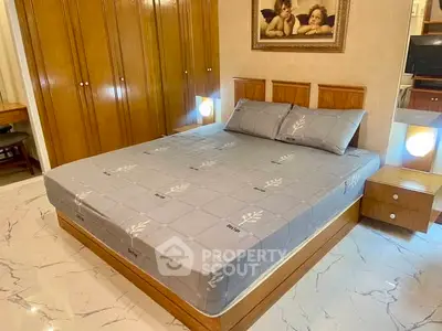 Spacious bedroom with elegant wooden furniture and cozy lighting