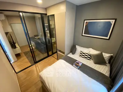 Modern bedroom with glass partition and stylish decor in a cozy apartment
