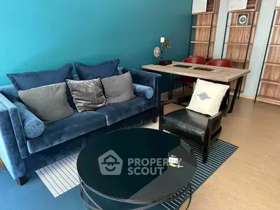 Stylish living room with blue sofa and modern decor