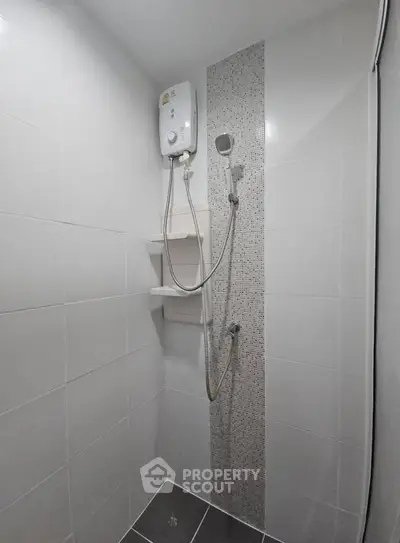 Modern bathroom with sleek shower and tiled walls