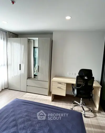 Modern bedroom with sleek wardrobe and ergonomic study desk