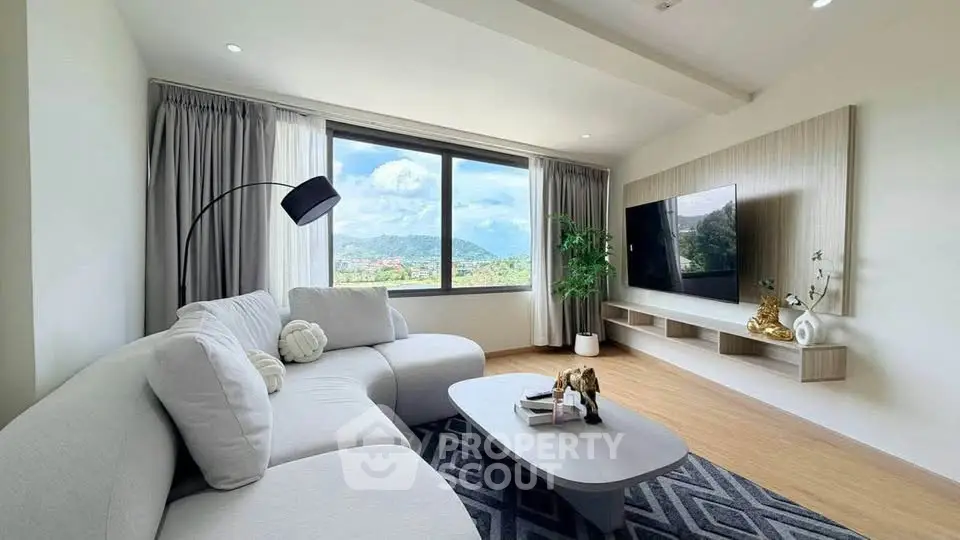 Spacious living room with modern decor and stunning mountain view