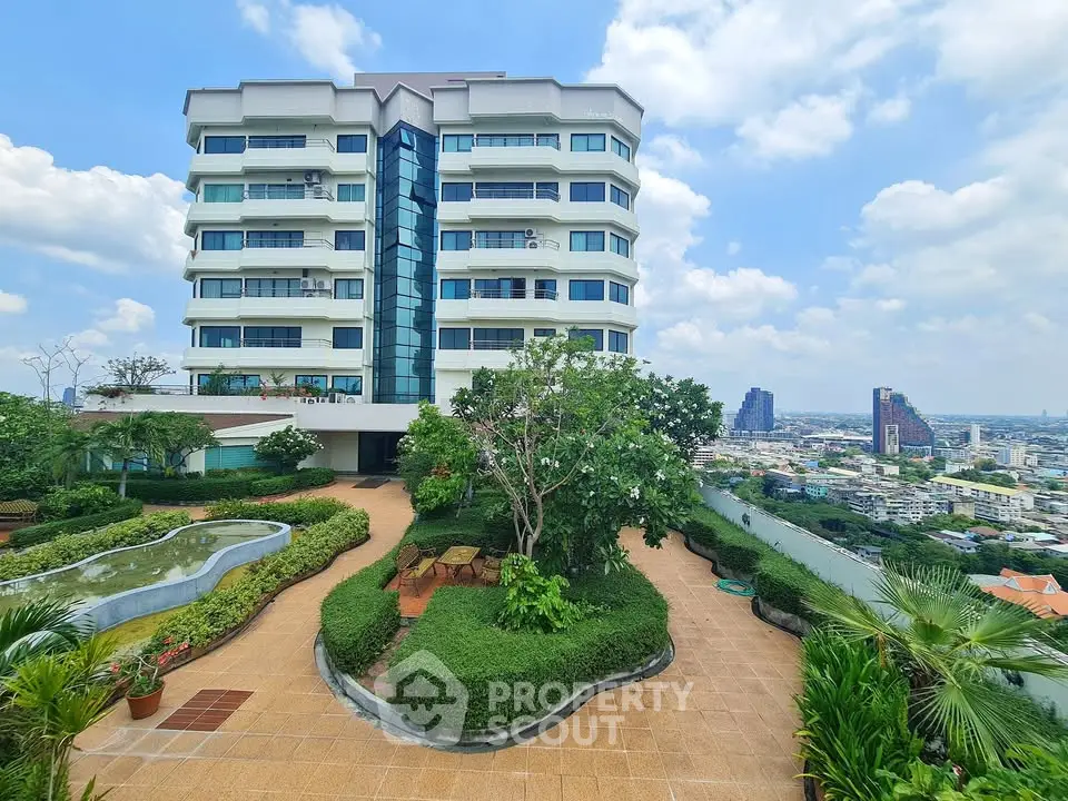 Stunning rooftop garden with panoramic city views and modern building exterior.