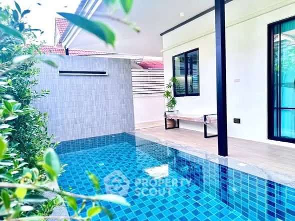 Stunning modern home with private pool and lush greenery for ultimate relaxation.